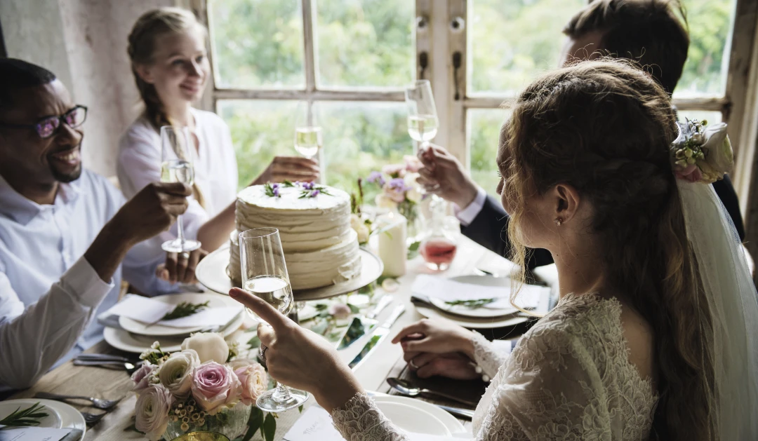 people cling wine glasses wedding reception with bride groom